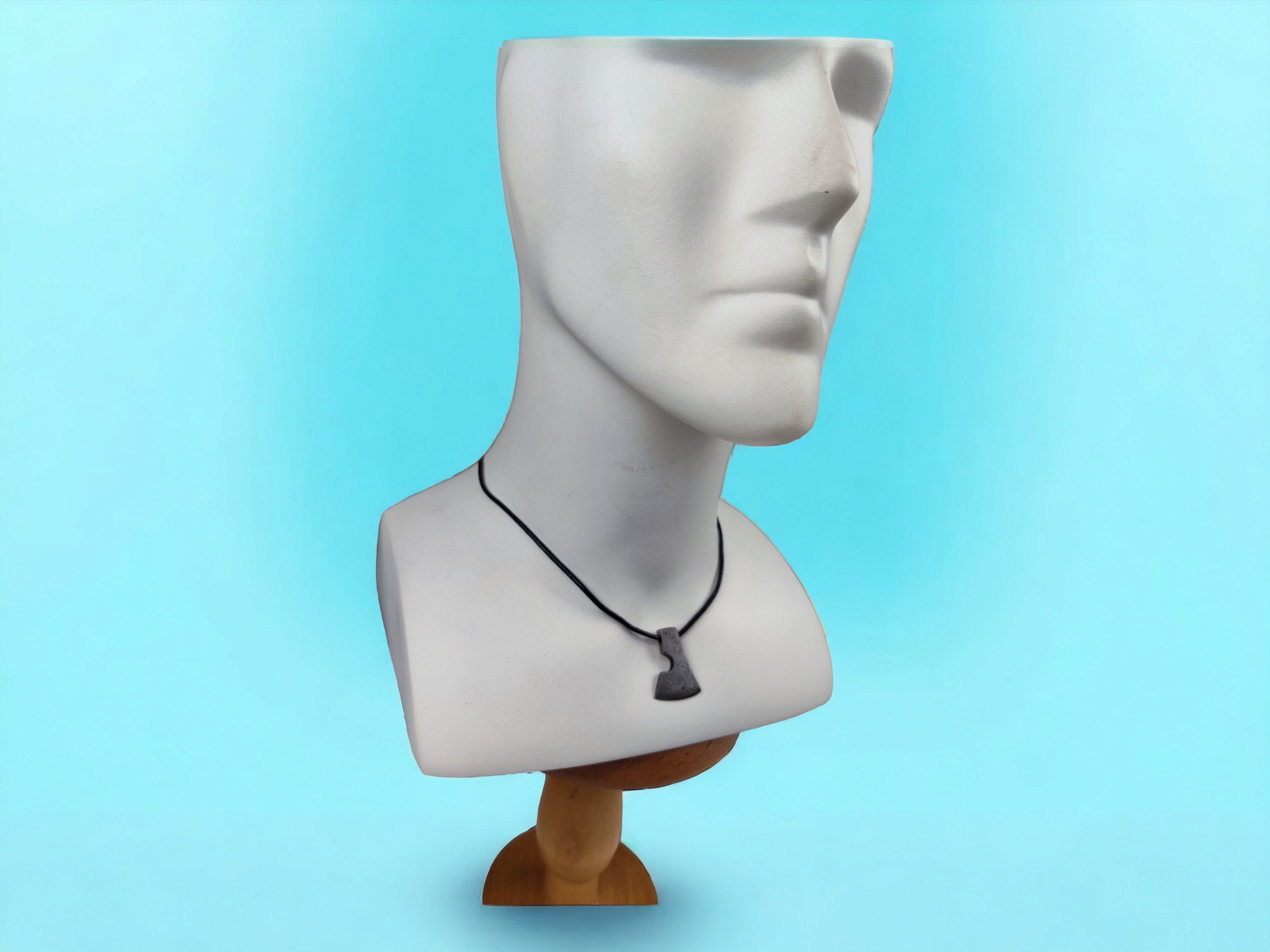 Handcrafted Steel Necklaces with Hammered Ax Figures: Forging Hot Iron Using Traditional Techniques