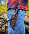Blacksmith hand forged primitive style custom carbon steel knife with leather sheath